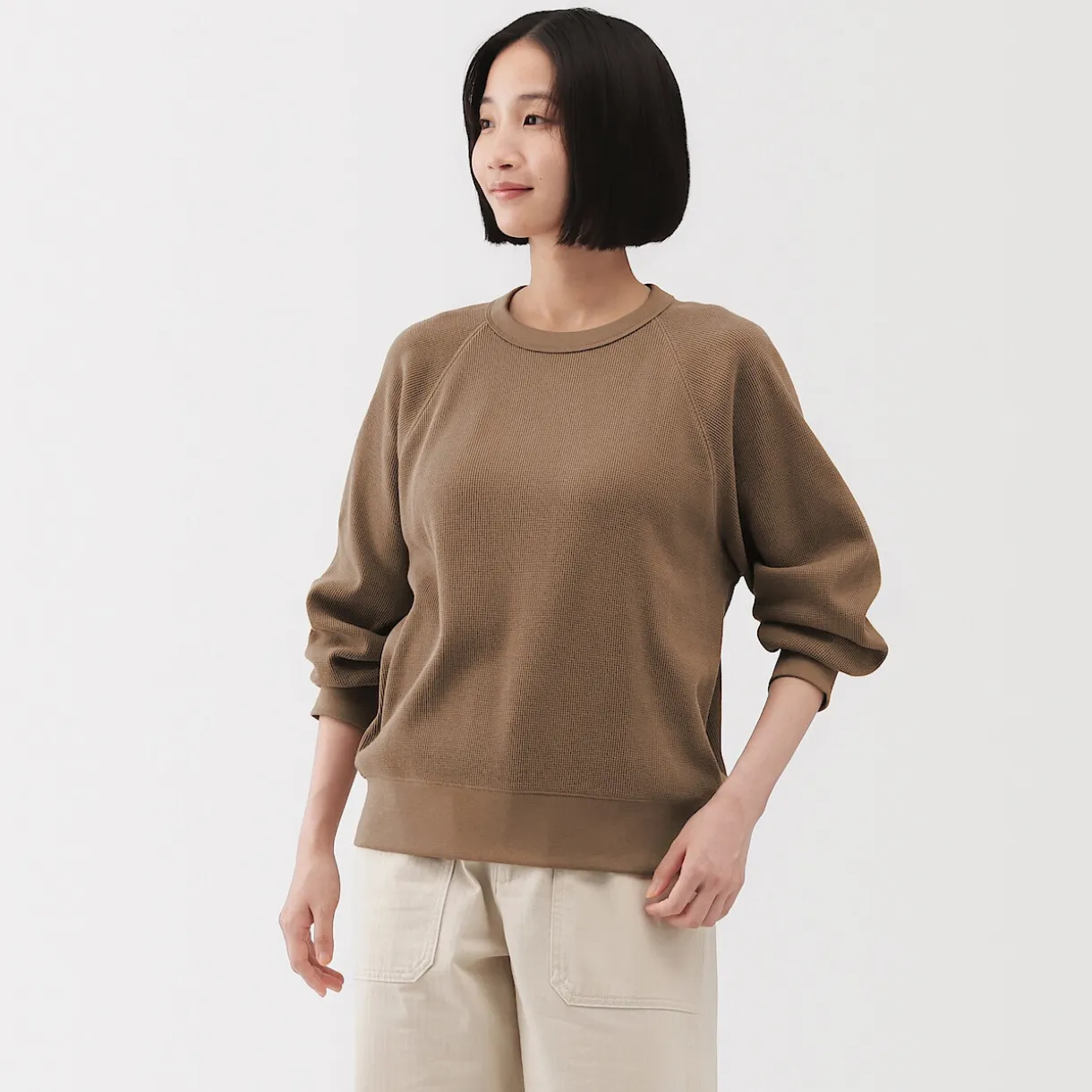 Pull à col rond en coton biologique tricoté gaufré pour femme