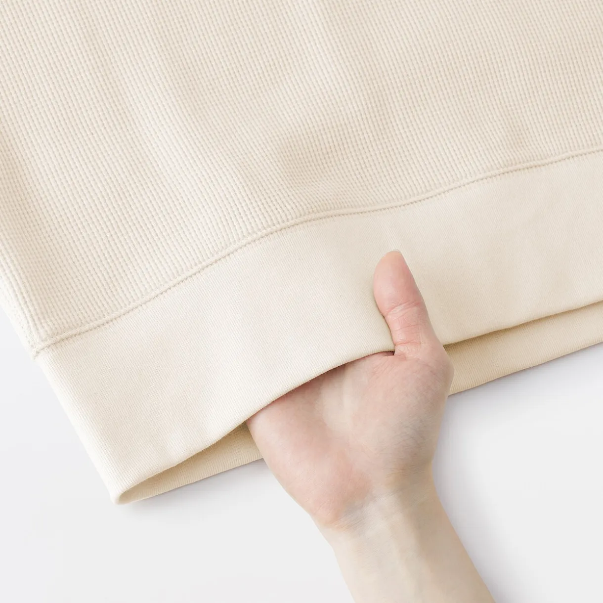 Pull à col rond en coton biologique tricoté gaufré pour femme