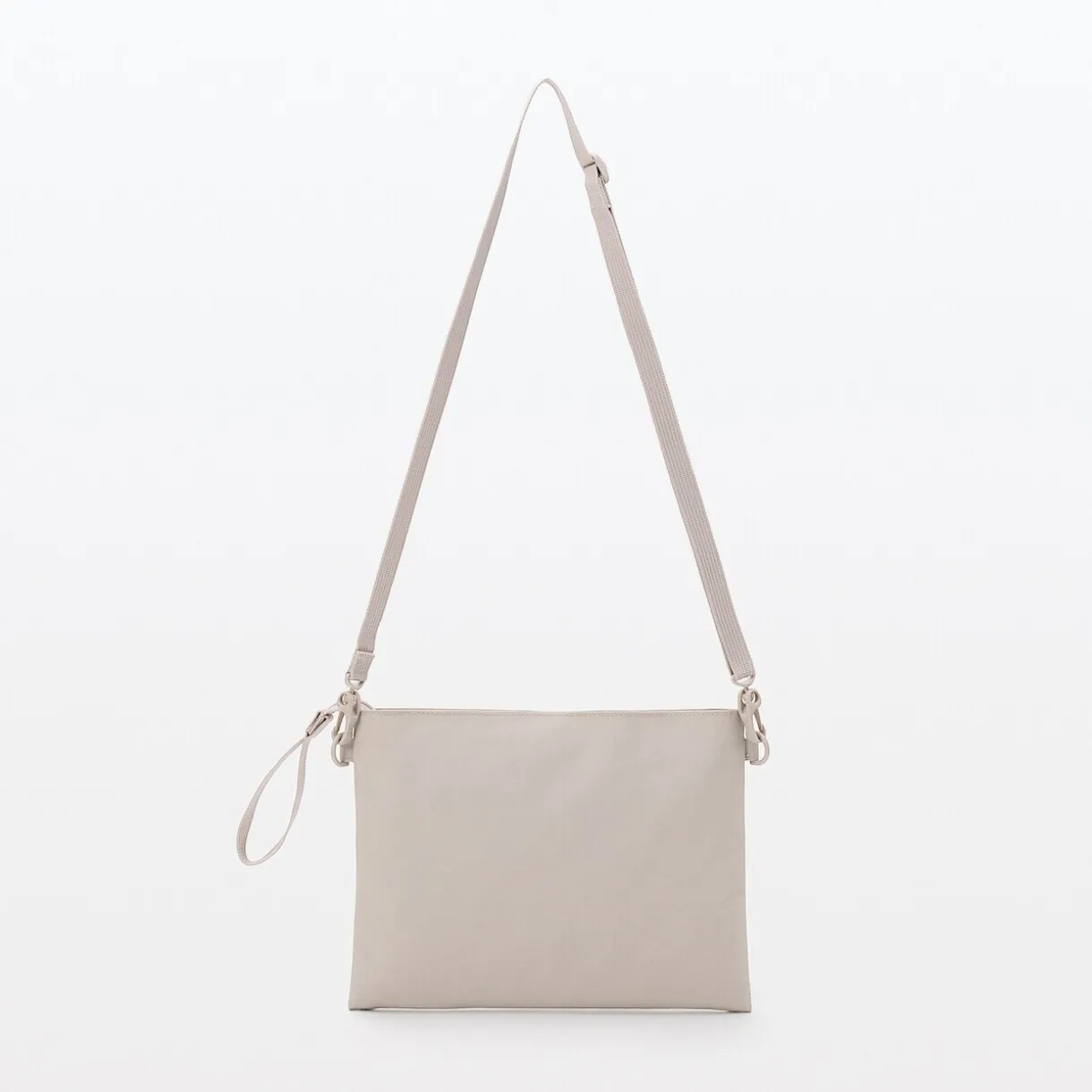 Sacoche à bandoulière déperlante détachable.